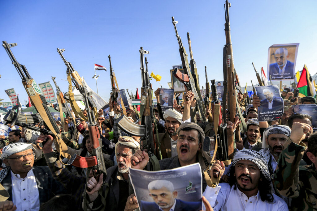 Supporters of Yemen’s Houthis gather with pictures of Hamas’ slain leader Yahya Sinwar during a rally held in the Houthi-controlled capital Sanaa on Oct. 18, 2024. Photo by Mohammed HUWAIS/AFP.