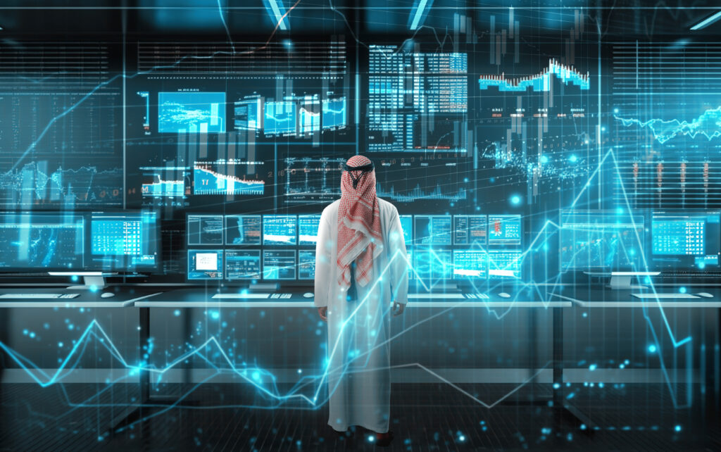Businessman in a data center. Created by FabrikaCR via Getty Images.