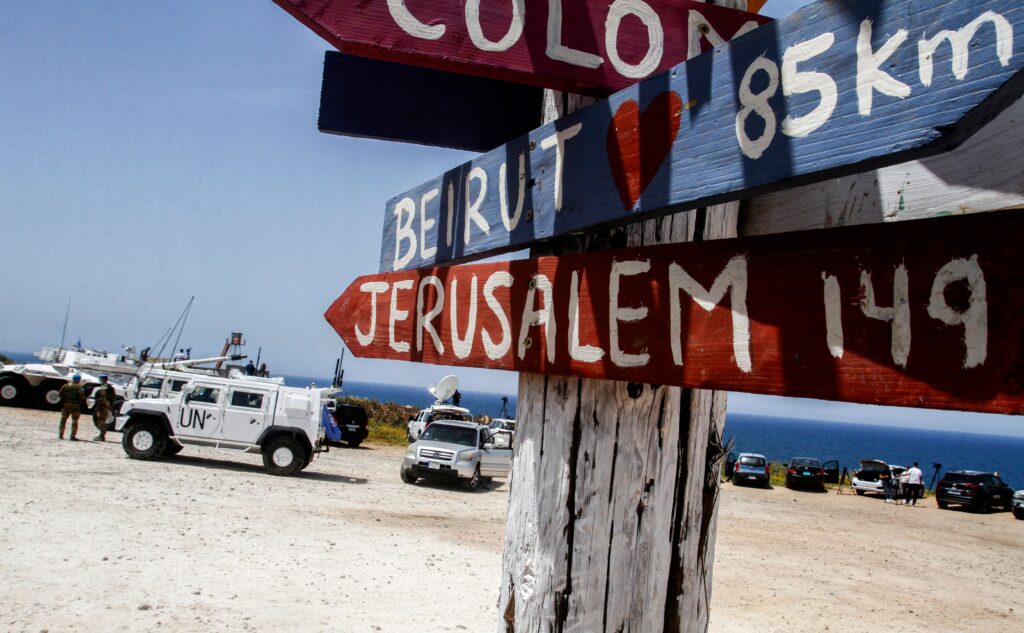 UNIFIL vehicles are stationed along the main road near Naqoura in southern Lebanon, close to the border with Israel, on May 4, 2021. Photo by Mahmoud Zayyat/AFP via Getty Images.