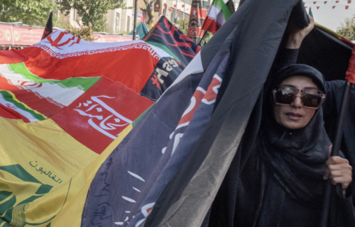 woman holding flags