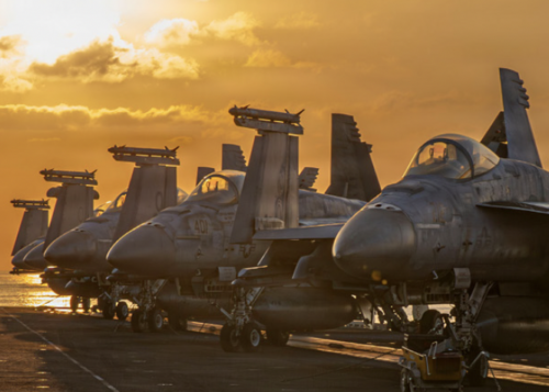 fighter jets parked on aircraft carrier